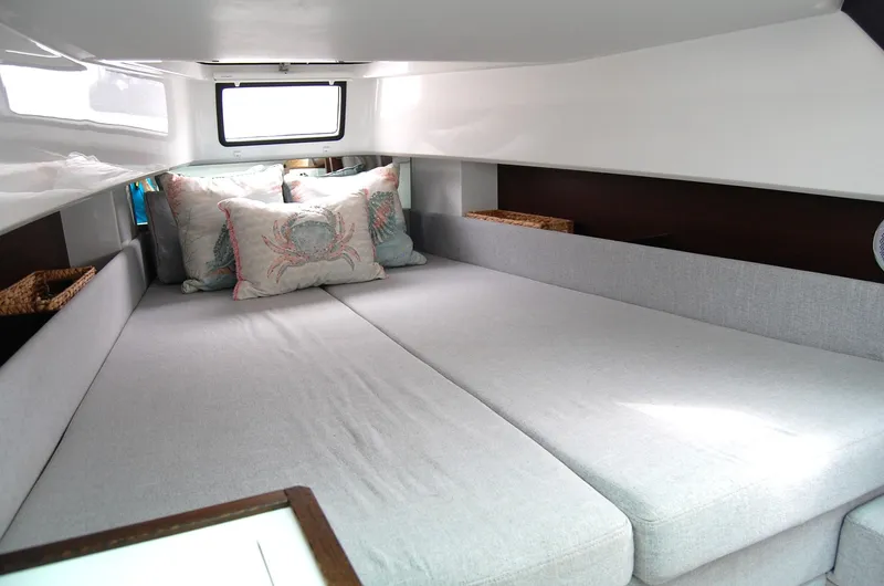  Yacht Photos Pics Interior cabin of 2019 Axopar 37 SC with cozy bedding and pillows.