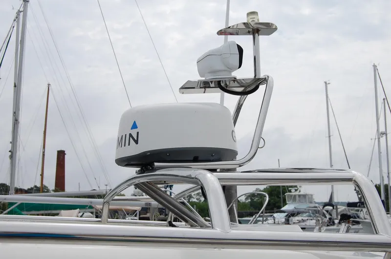  Yacht Photos Pics Radar equipment on 2019 Axopar 37 SC boat, docked in a marina.