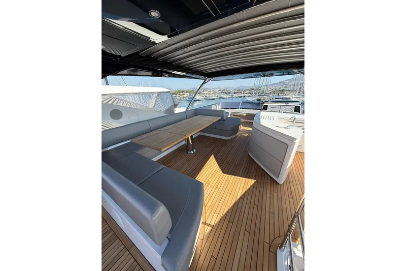 Svetlana Yacht Photos Pics Luxurious 2025 Sunseeker 76 Yacht deck with elegant seating and wooden flooring.