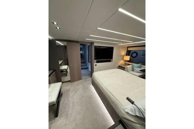 Svetlana Yacht Photos Pics Luxurious interior of 2025 Sunseeker 76 Yacht, featuring modern bedroom design and ambient lighting.
