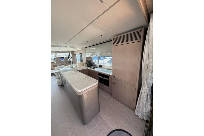 Svetlana Yacht Photos Pics Luxurious interior of 2025 Sunseeker 76 Yacht with modern kitchen design.