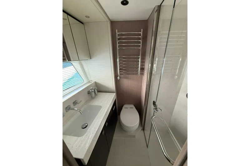 Svetlana Yacht Photos Pics Luxurious bathroom in 2025 Sunseeker 76 Yacht with modern fixtures and elegant design.