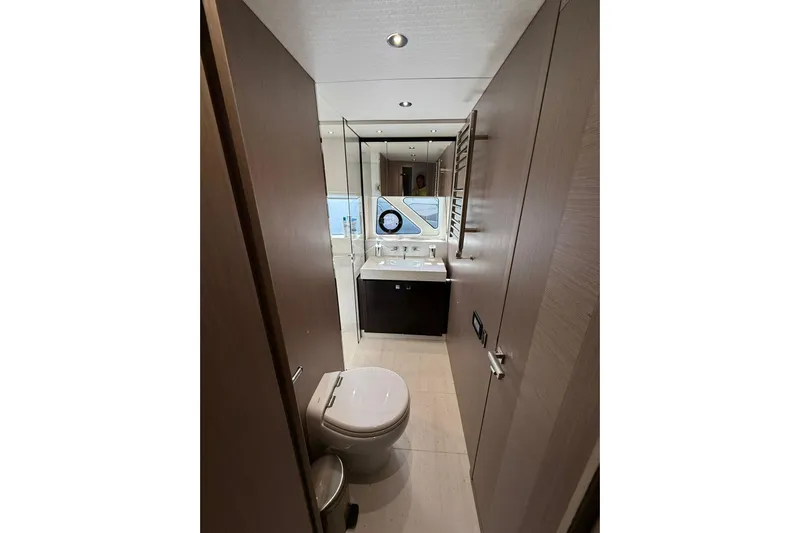 Svetlana Yacht Photos Pics Luxurious bathroom in 2025 Sunseeker 76 Yacht, featuring modern fixtures and elegant design.