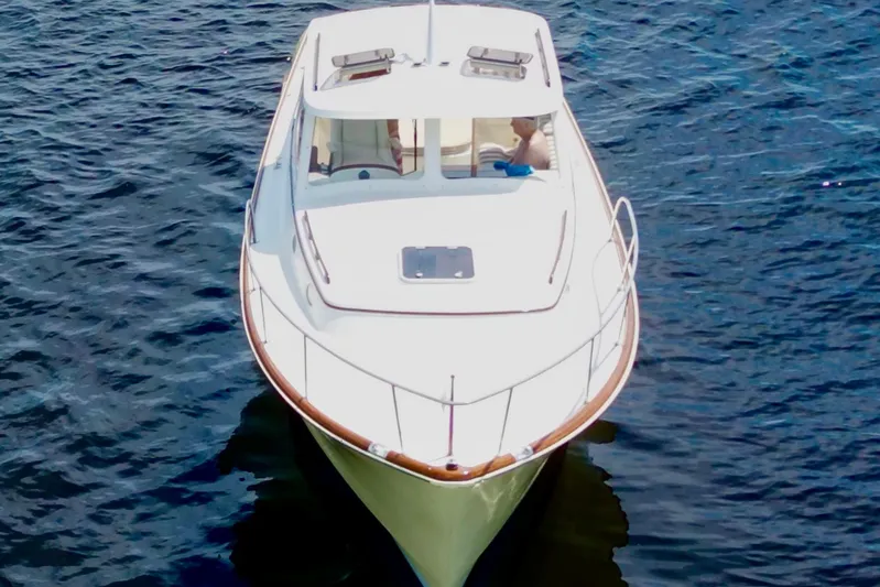 Stardust Yacht Photos Pics 1996 Hinckley Picnic Boat cruising on open water, aerial view.