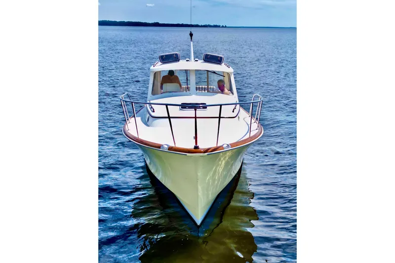 Stardust Yacht Photos Pics 1996 Hinckley Picnic Boat on calm water, front view.