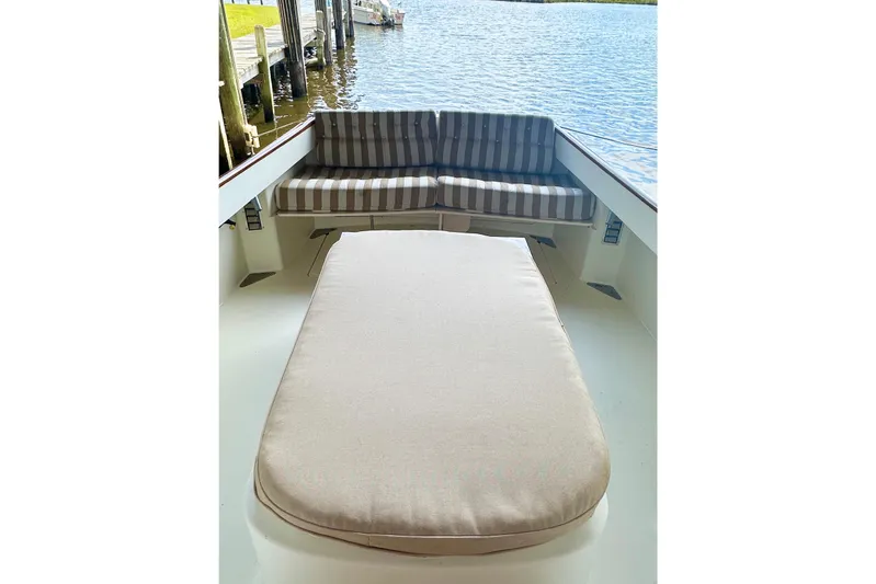 Stardust Yacht Photos Pics Hinckley Picnic Boat 1996 interior with striped seating and water view.