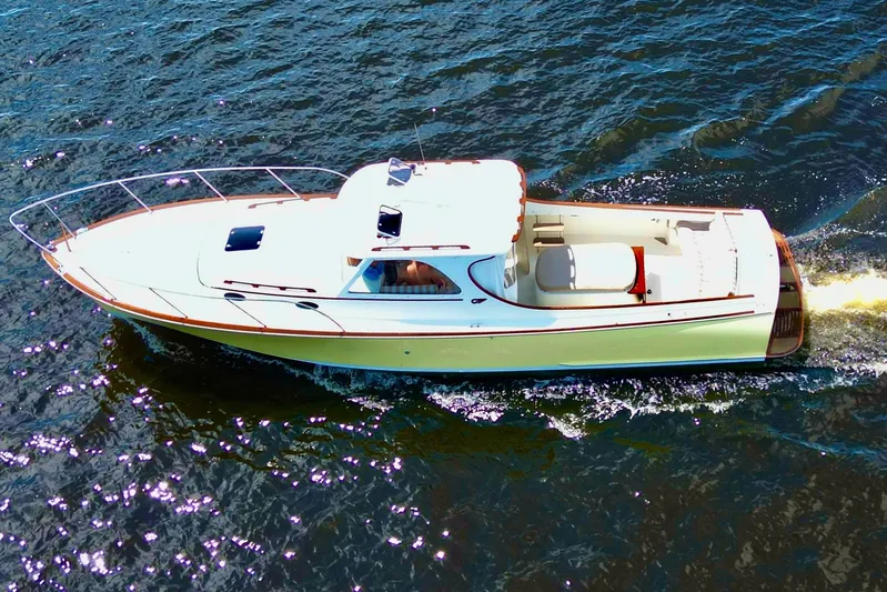 Stardust Yacht Photos Pics 1996 Hinckley Picnic Boat cruising on open water, aerial view.