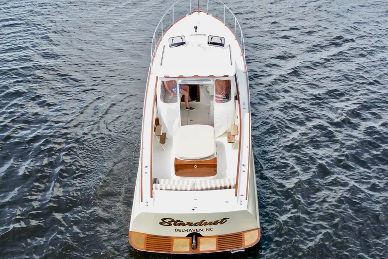 Stardust Yacht Photos Pics 1996 Hinckley Picnic Boat on water, named "Stardust," viewed from above.