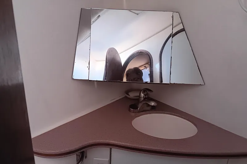 Heart Of Gold Yacht Photos Pics Corner bathroom sink with mirror in 1998 Hunter 450 model yacht.