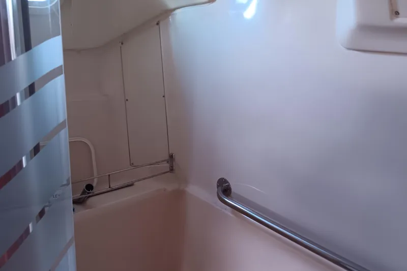 Heart Of Gold Yacht Photos Pics Interior of a 1998 Hunter 450 yacht bathroom with shower and grab bar.