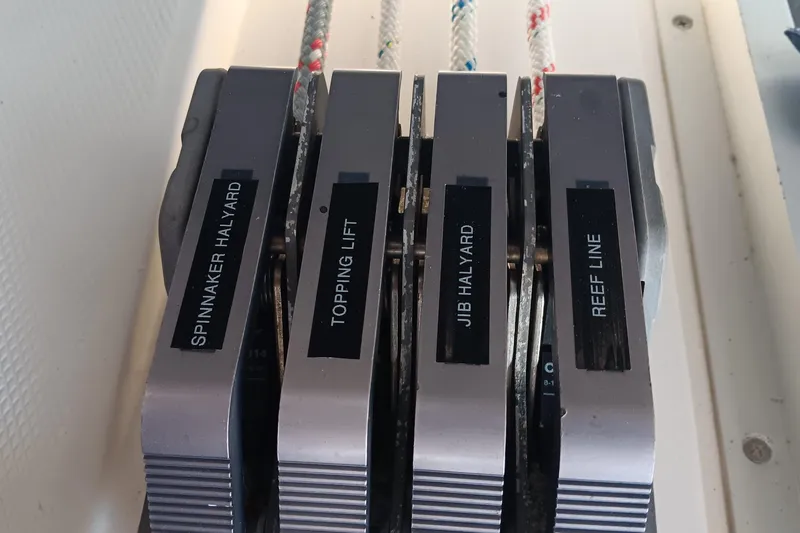 Heart Of Gold Yacht Photos Pics Sailboat control panel with labeled halyards and reef line, Hunter 450, 1998 model.