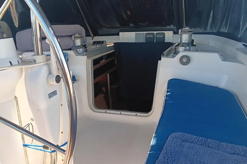 Heart Of Gold Yacht Photos Pics Interior view of a 1998 Hunter 450 sailboat cockpit with blue seating.