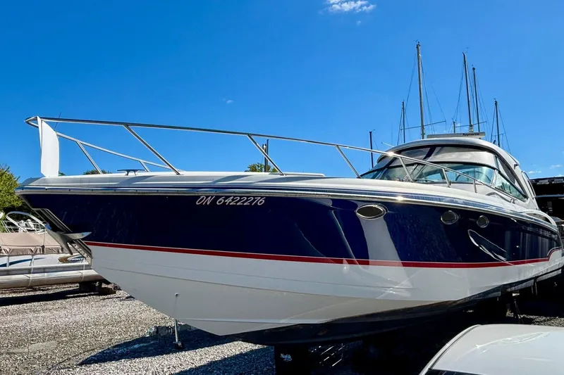  Yacht Photos Pics 2007 Formula 400 Super Sport boat with sleek design, docked under clear blue sky.