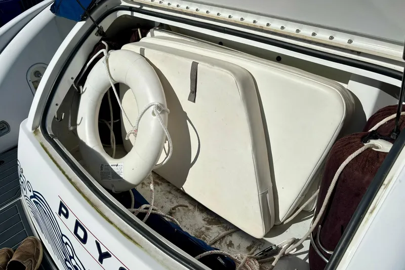  Yacht Photos Pics Storage compartment of 2007 Formula 400 Super Sport boat with life preserver and cushions.