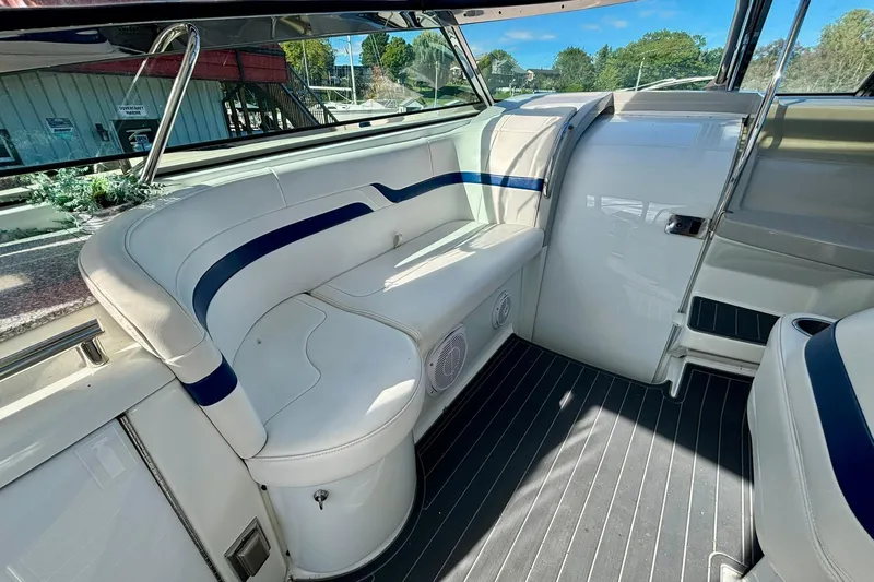  Yacht Photos Pics Interior of a 2007 Formula 400 Super Sport boat with white seating and blue accents.