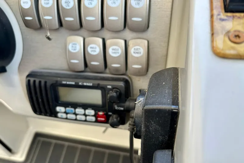  Yacht Photos Pics Control panel of a 2007 Formula 400 Super Sport boat with switches and marine radio.