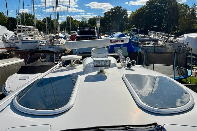  Yacht Photos Pics 2007 Formula 400 Super Sport yacht docked among other boats under a clear sky.