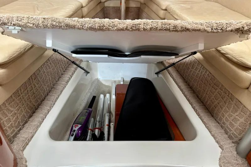  Yacht Photos Pics 2007 Formula 400 Super Sport boat interior storage compartment with open lid and stored items.