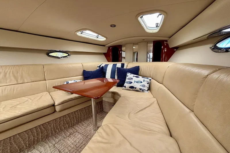  Yacht Photos Pics Luxurious interior of a 2007 Formula 400 Super Sport yacht with beige seating and cushions.