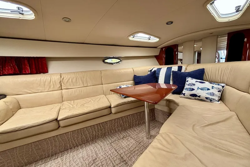  Yacht Photos Pics Luxurious interior of a 2007 Formula 400 Super Sport yacht with beige seating and decorative pillows.