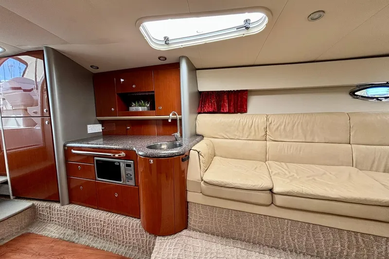  Yacht Photos Pics Luxurious interior of 2007 Formula 400 Super Sport yacht with kitchenette and beige seating.