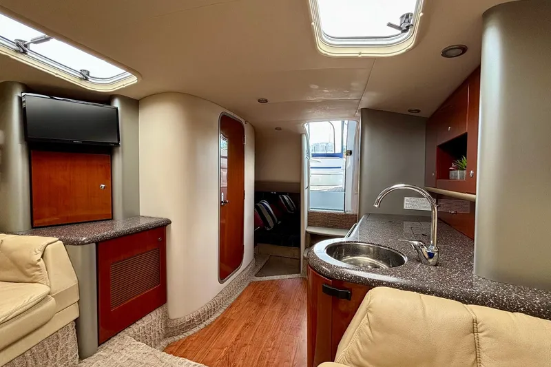  Yacht Photos Pics Interior of 2007 Formula 400 Super Sport yacht with kitchenette and seating area.