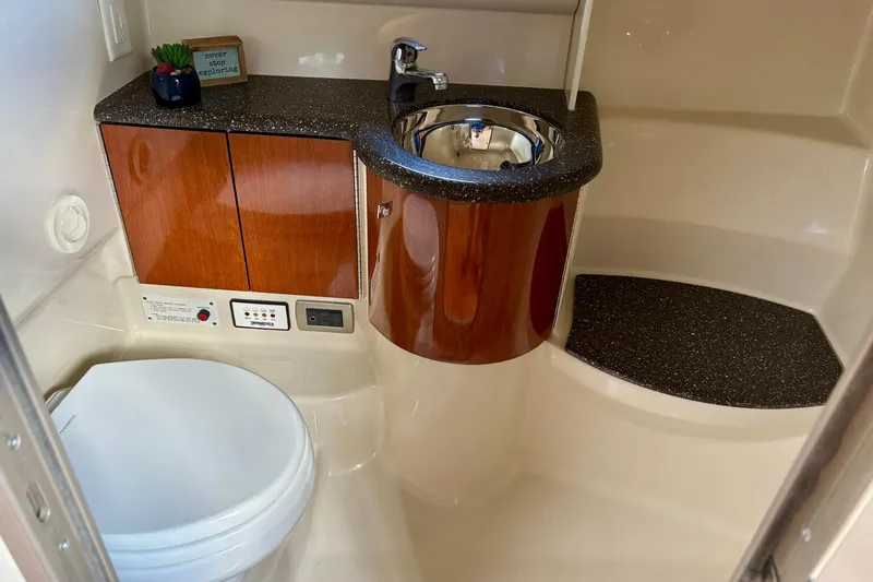  Yacht Photos Pics 2007 Formula 400 Super Sport bathroom with wood cabinetry and modern fixtures.