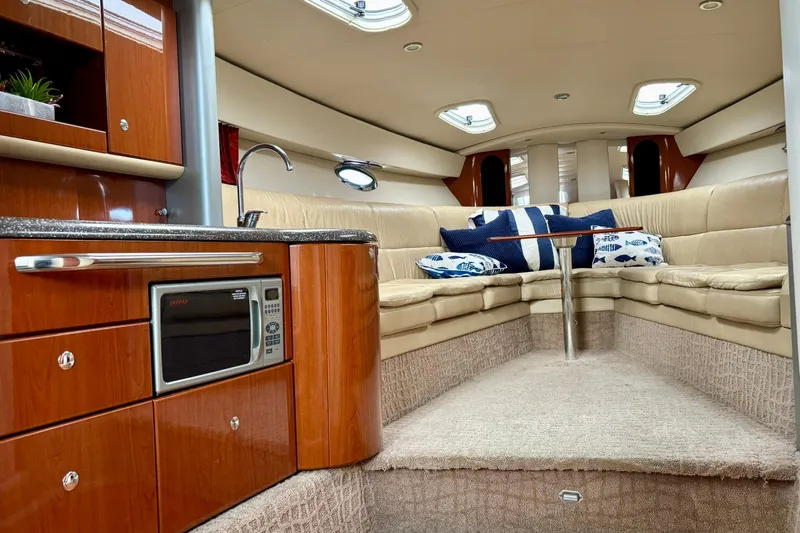  Yacht Photos Pics Luxurious interior of a 2007 Formula 400 Super Sport yacht with plush seating and kitchenette.