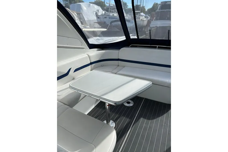  Yacht Photos Pics 2007 Formula 400 Super Sport boat interior with seating and table, docked at marina.