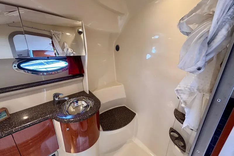  Yacht Photos Pics 2007 Formula 400 Super Sport yacht bathroom with sink, mirror, and porthole window.