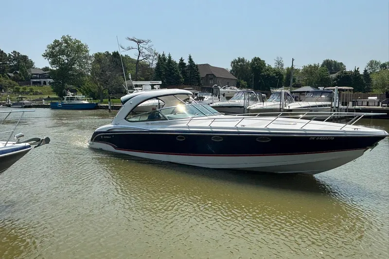  Yacht Photos Pics 2007 Formula 400 Super Sport boat docked in a serene marina setting.