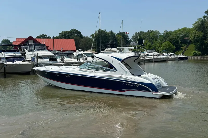  Yacht Photos Pics 2007 Formula 400 Super Sport boat docked in a marina with other vessels.