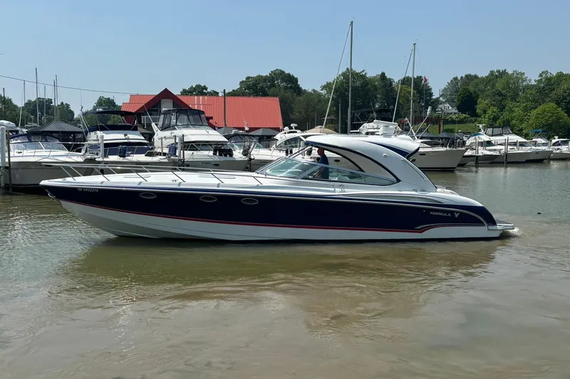  Yacht Photos Pics 2007 Formula 400 Super Sport boat docked in a marina with other vessels.