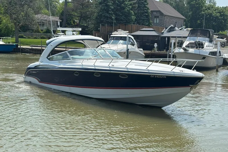  Yacht Photos Pics 2007 Formula 400 Super Sport boat docked in a marina, surrounded by other vessels.
