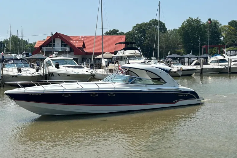  Yacht Photos Pics 2007 Formula 400 Super Sport boat docked at a marina with other vessels.