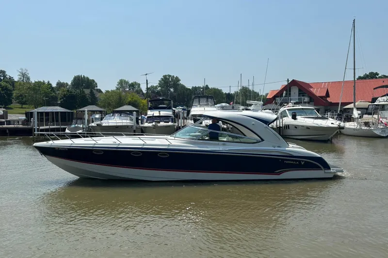  Yacht Photos Pics 2007 Formula 400 Super Sport boat docked at a marina on a sunny day.