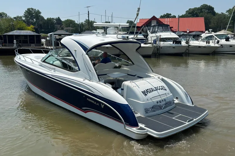  Yacht Photos Pics 2007 Formula 400 Super Sport boat docked at marina, featuring sleek design and spacious deck.