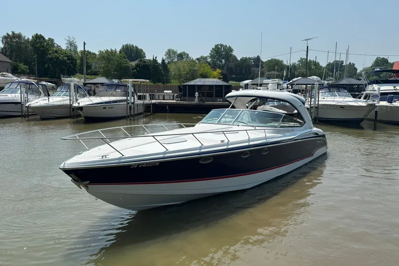  Yacht Photos Pics 2007 Formula 400 Super Sport boat docked in a marina, surrounded by other vessels.