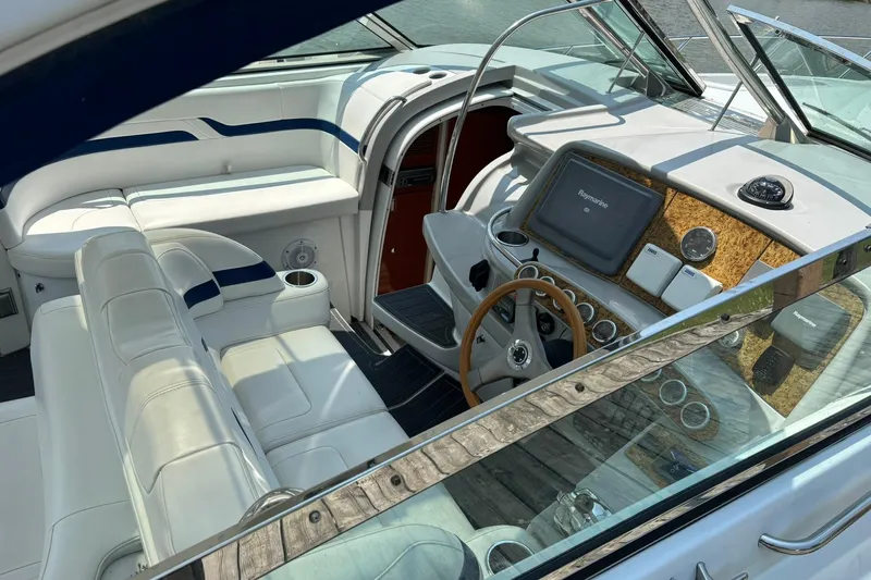  Yacht Photos Pics 2007 Formula 400 Super Sport boat interior with white seating and modern dashboard.