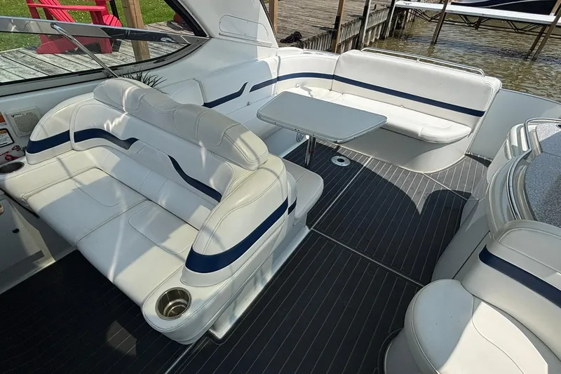  Yacht Photos Pics 2007 Formula 400 Super Sport boat interior with white seating and table, dockside view.