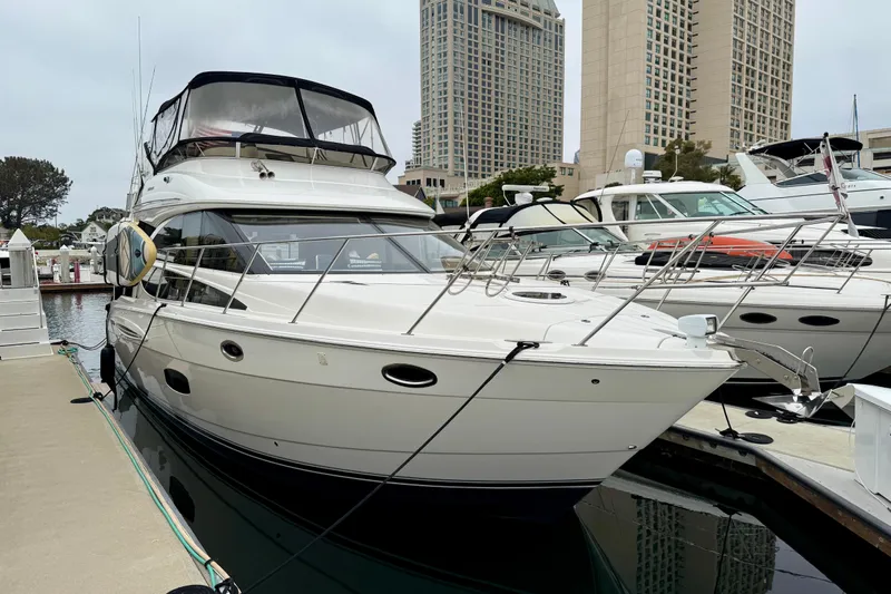  Yacht Photos Pics 2014 Meridian 391 Sedan yacht docked at marina with cityscape background.