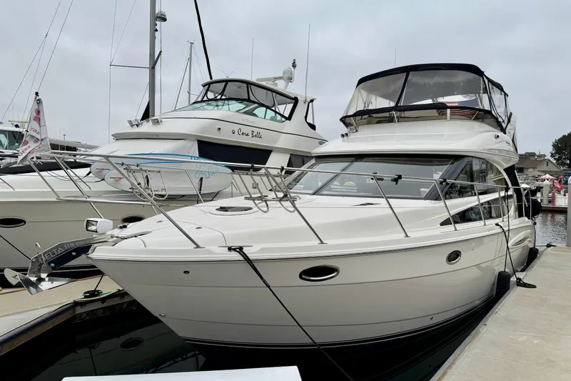  Yacht Photos Pics 2014 Meridian 391 Sedan yacht docked at marina, showcasing sleek design and luxury features.