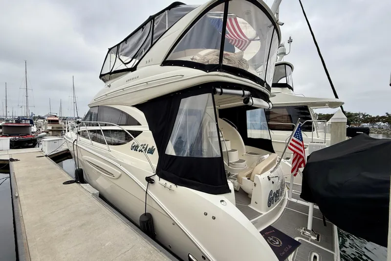  Yacht Photos Pics 2014 Meridian 391 Sedan yacht docked at marina with American flag.