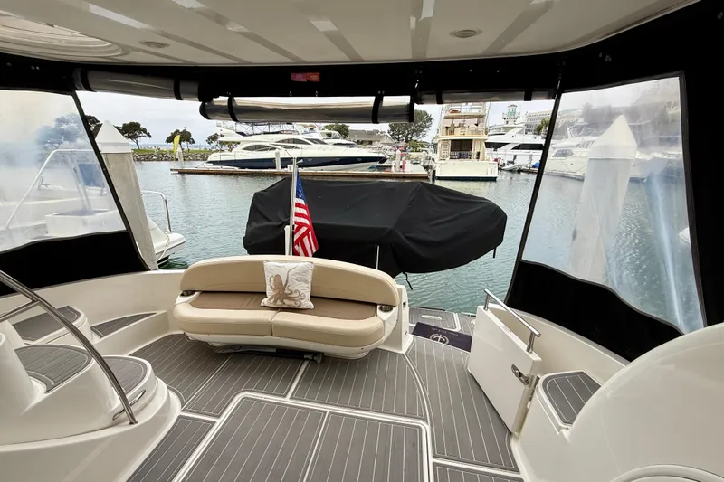  Yacht Photos Pics 2014 Meridian 391 Sedan yacht interior with seating, docked at marina.