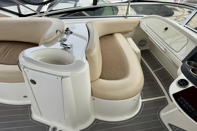  Yacht Photos Pics 2014 Meridian 391 Sedan interior with beige seating and compact sink area.