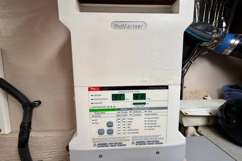  Yacht Photos Pics ProMariner battery charger in a 2014 Meridian 391 Sedan, displaying voltage and amperage readings.