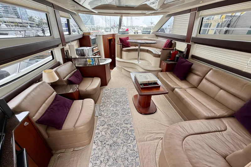  Yacht Photos Pics Luxurious interior of 2014 Meridian 391 Sedan yacht with plush seating and elegant decor.