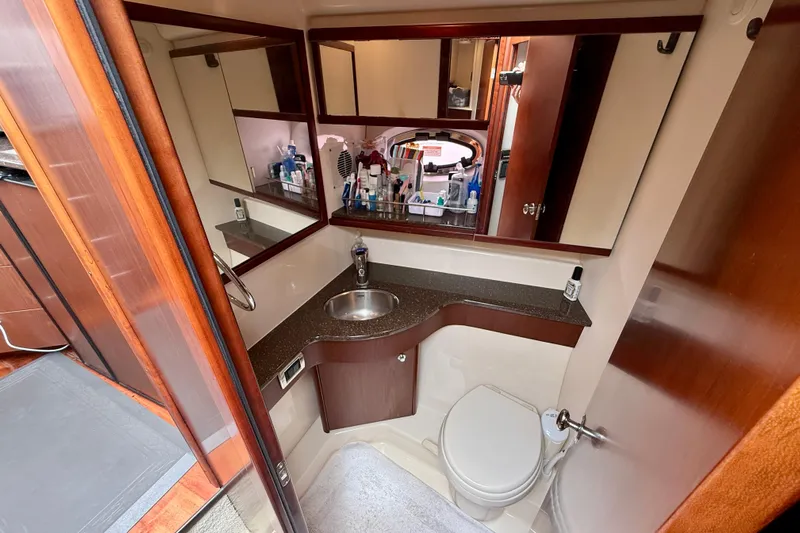  Yacht Photos Pics Luxurious bathroom in 2014 Meridian 391 Sedan yacht with modern fixtures and ample storage.