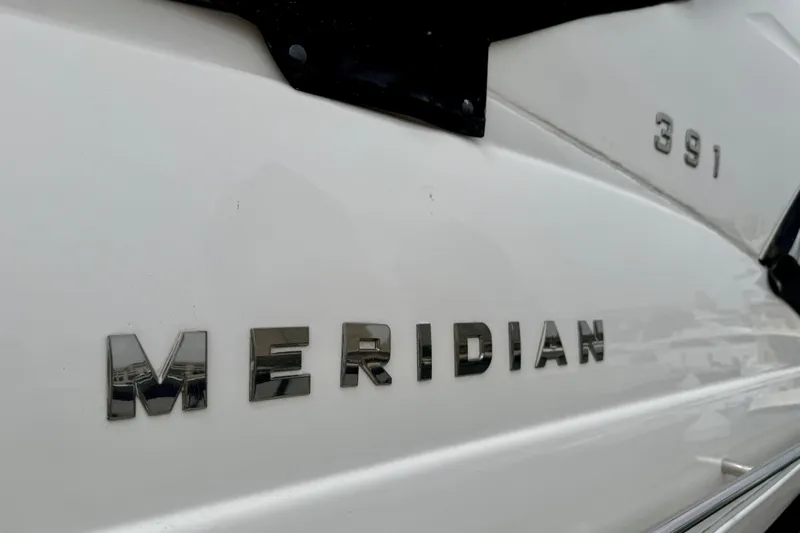  Yacht Photos Pics 2014 Meridian 391 Sedan boat nameplate with chrome lettering on white hull.