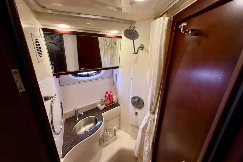  Yacht Photos Pics Luxurious bathroom in 2014 Meridian 391 Sedan yacht with modern fixtures and elegant design.